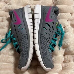 Nike Women's Gray Athletic Sneakers with Teal Laces and Purple Swoosh